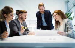 Group of architects and business people working together and brainstorming